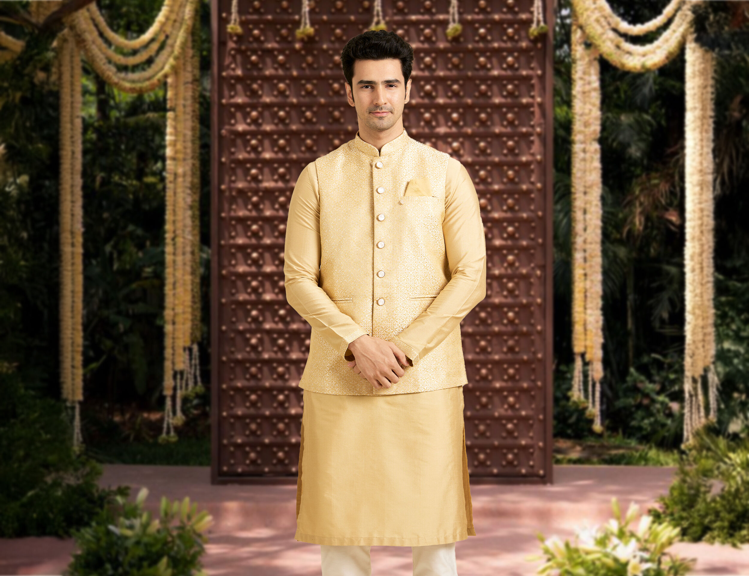 A man in a bright kurta