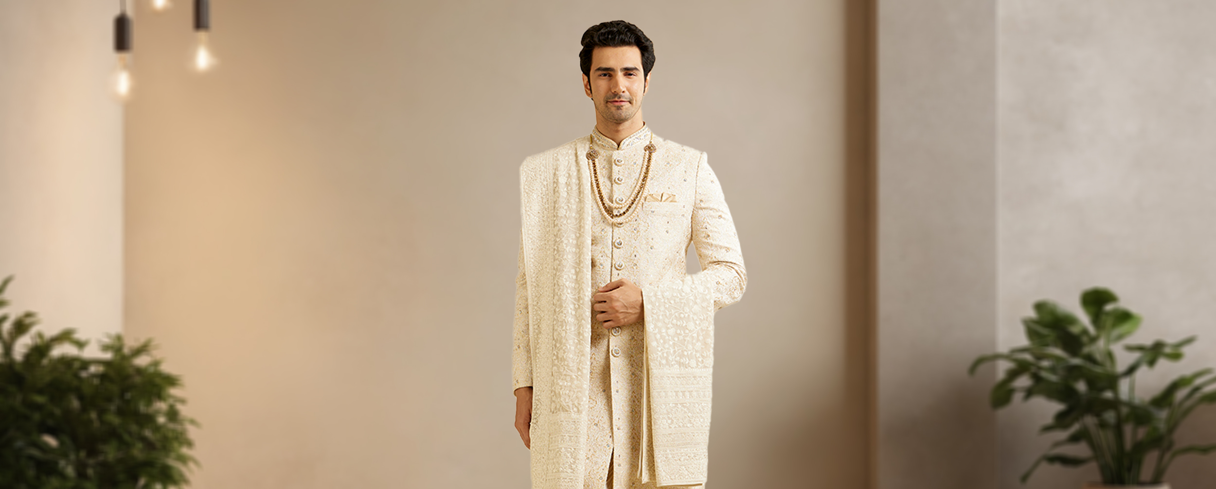 A man wearing beautifull royl style white sherwani with white dupatta