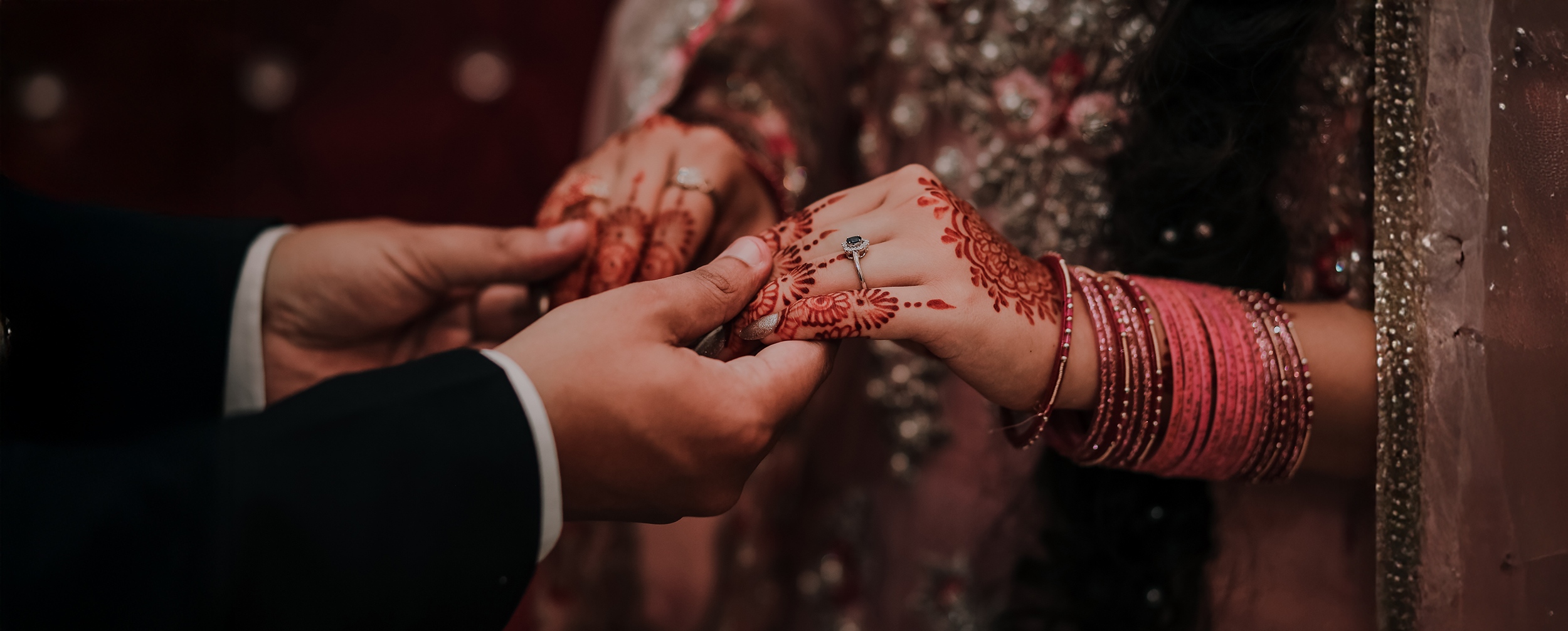A groom holding brides hand