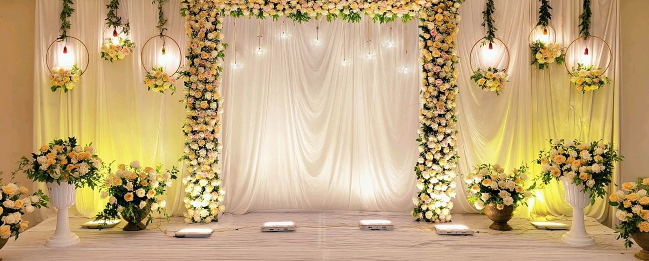 Stunning bridal shower setup featuring vibrant flowers and elegant lighting for a memorable celebration.